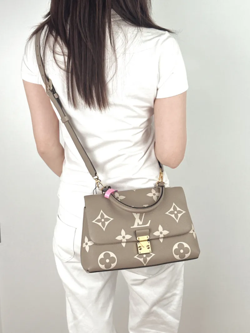 Louis Vuitton Crossbody Bag MADELEINE Empreinte Embossed Calfskin Medium30 × 11 × 19.5 cm — on-model view 2 of 3