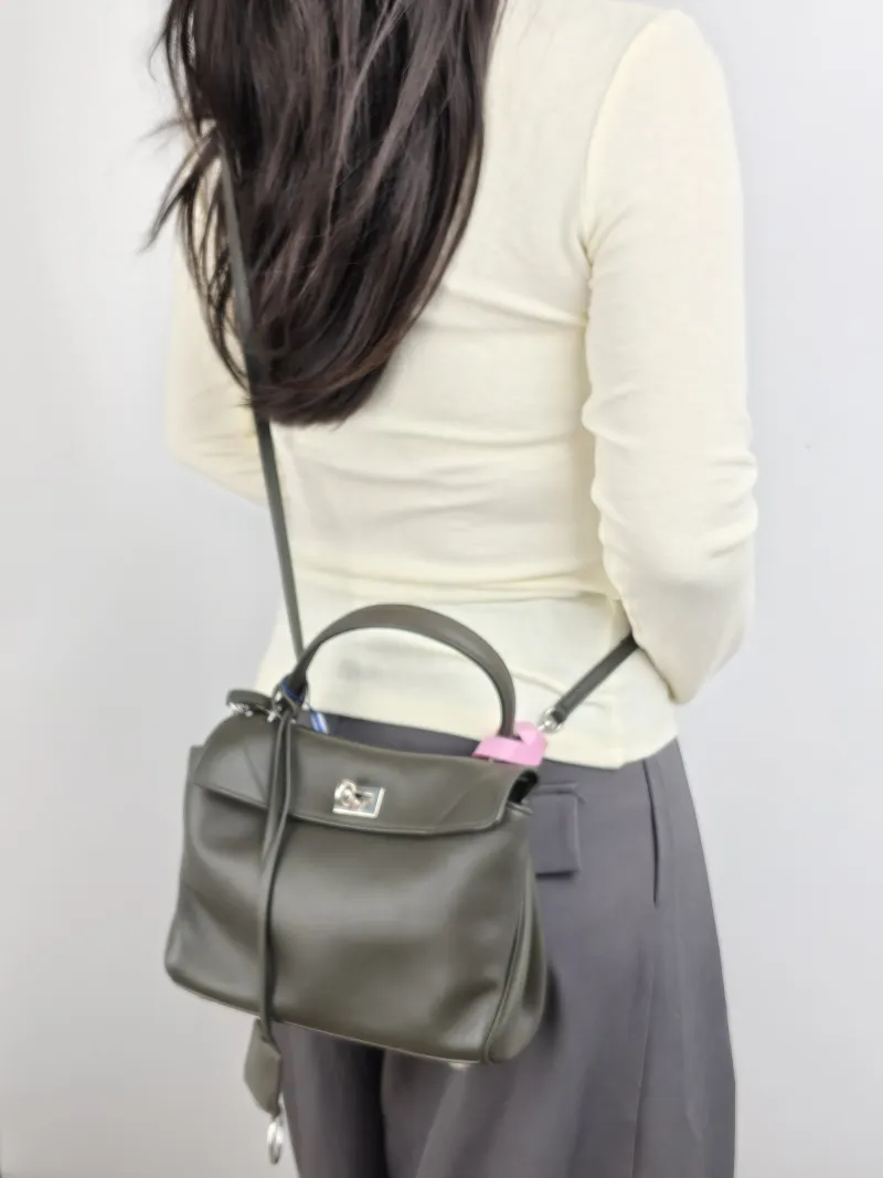 BALENCIAGA Crossbody Bag RODEO Calfskin Mini 23 × 10 × 17 cm — on-model view 1 of 2