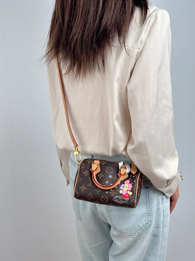 Louis Vuitton Crossbody Bag Speedy Nano Monogram · Vivienne PVC nano 16 × 7.5 × 10 cm — on-model view 1 of 2
