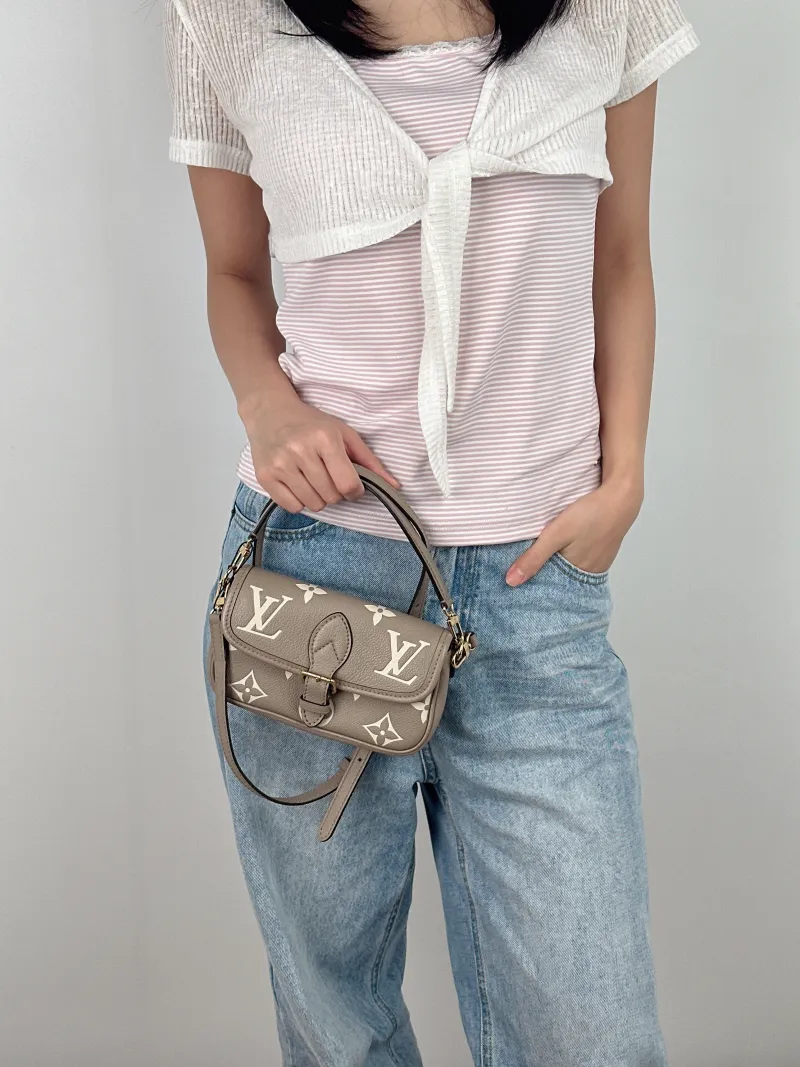 Louis Vuitton Crossbody Bag Diane Baguette Bag Empreinte Embossed Calfskinnano19 × 6 × 10.5 cm — on-model view 1 of 3