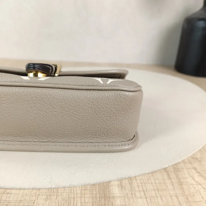 Louis Vuitton Crossbody Bag Diane Baguette Bag Empreinte Embossed Calfskin nano 19 × 6 × 10.5 cm — detail view 11 of 12