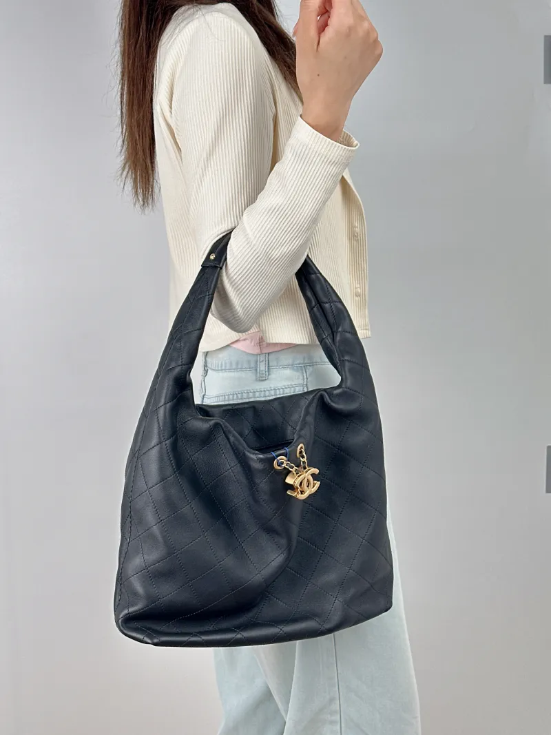 Chanel Crossbody Bag 26c hobo Black Calfskin Large 37 × 8 × 30 cm — on-model view 1 of 2