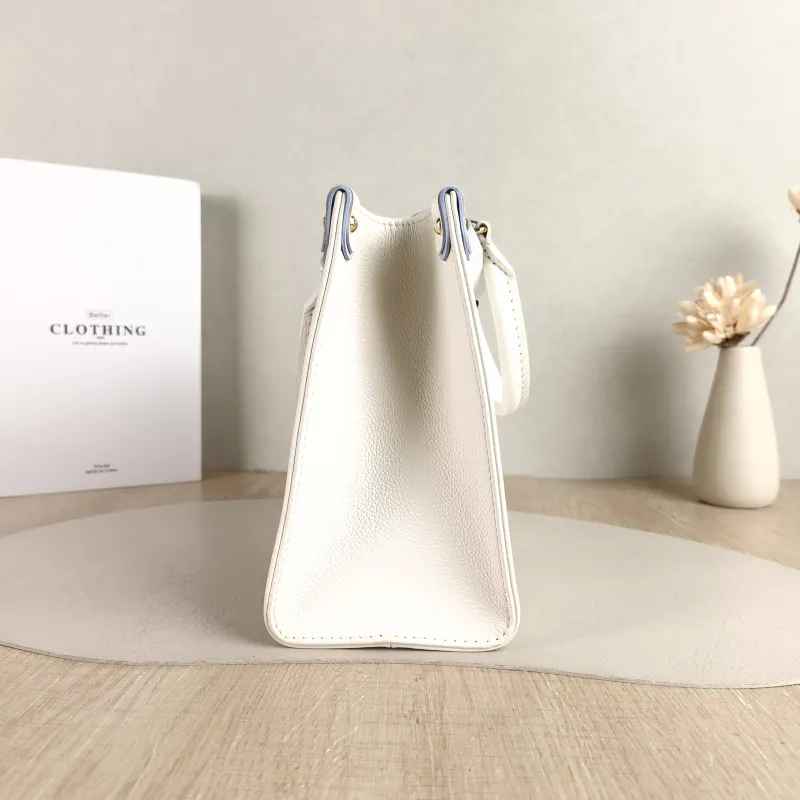 Louis Vuitton Shoulder Bag Onthego White · Blue Monogram Empreinte Embossed Calfskin Small 25 × 11.5 × 19 cm — detail view 1 of 11