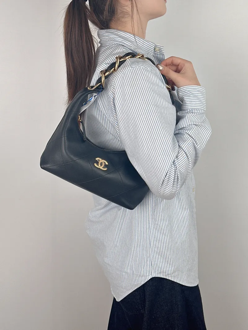 Chanel Shoulder Bag hobo Black with Gold-Tone Hardware Calfskin One Size 24 × 7 × 27 cm — on-model view 1 of 2