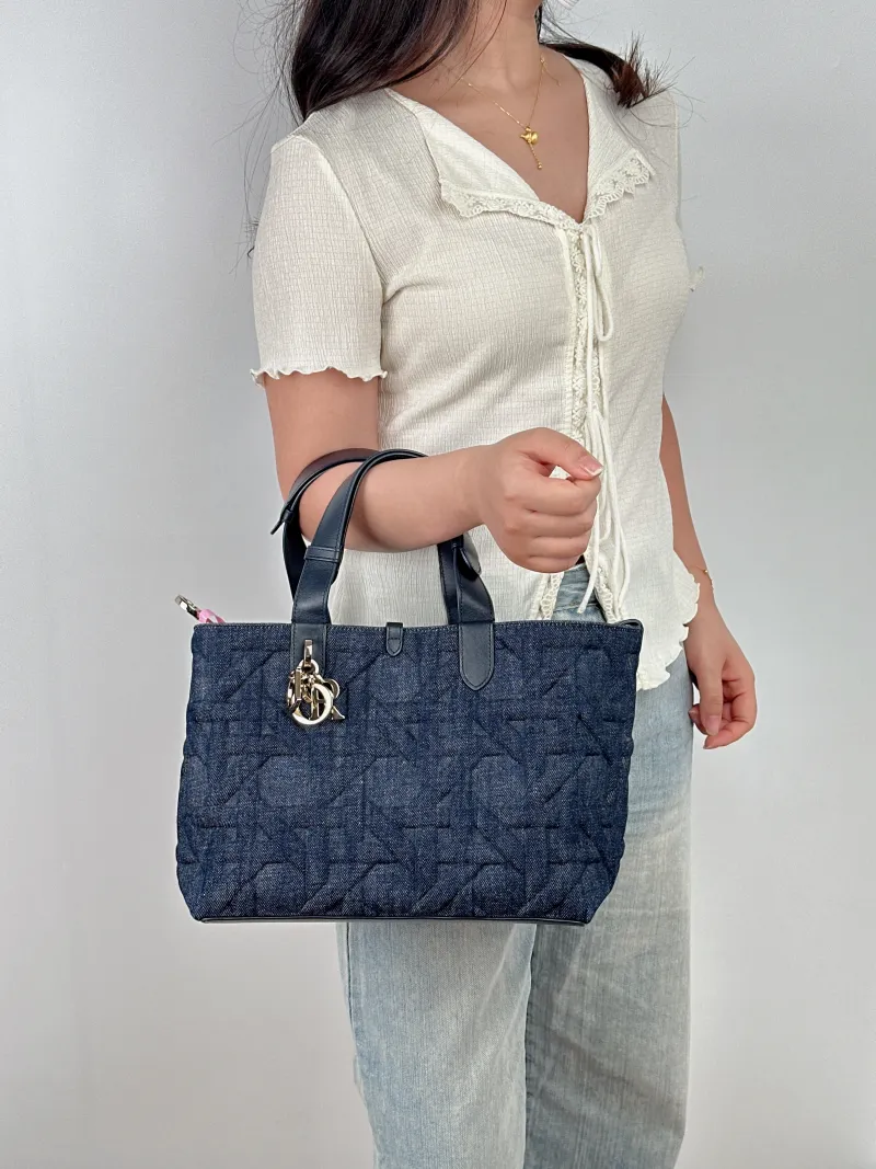 DIOR Top Handle Bag TOUJOURS Navy Medium 28.5 × 17 × 21.5 cm — on-model view 1 of 2