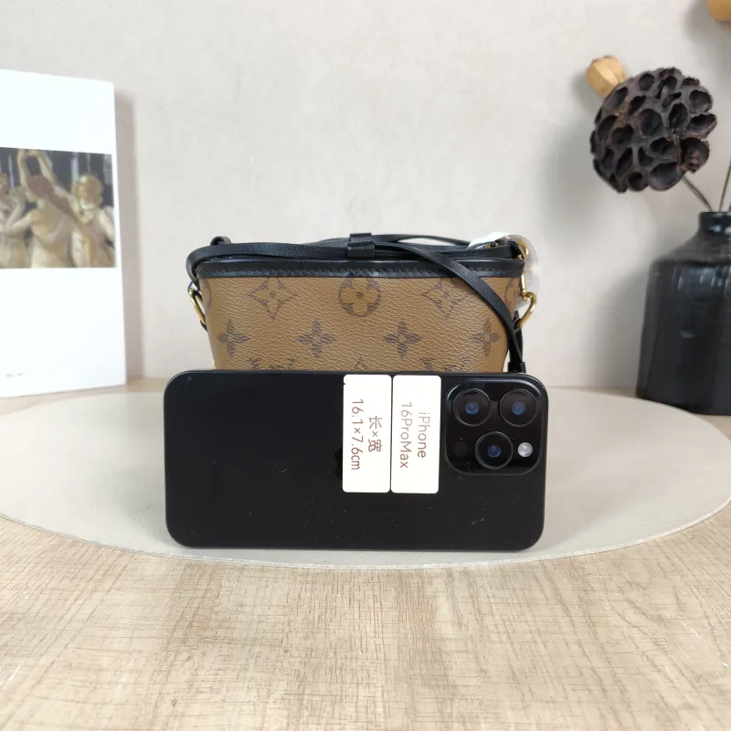Louis Vuitton Crossbody Bag NOÉ PURSE LV CHARMS Monogram PVC Mini 11.5 × 11.5 × 11.5 cm — cover view 2 of 6