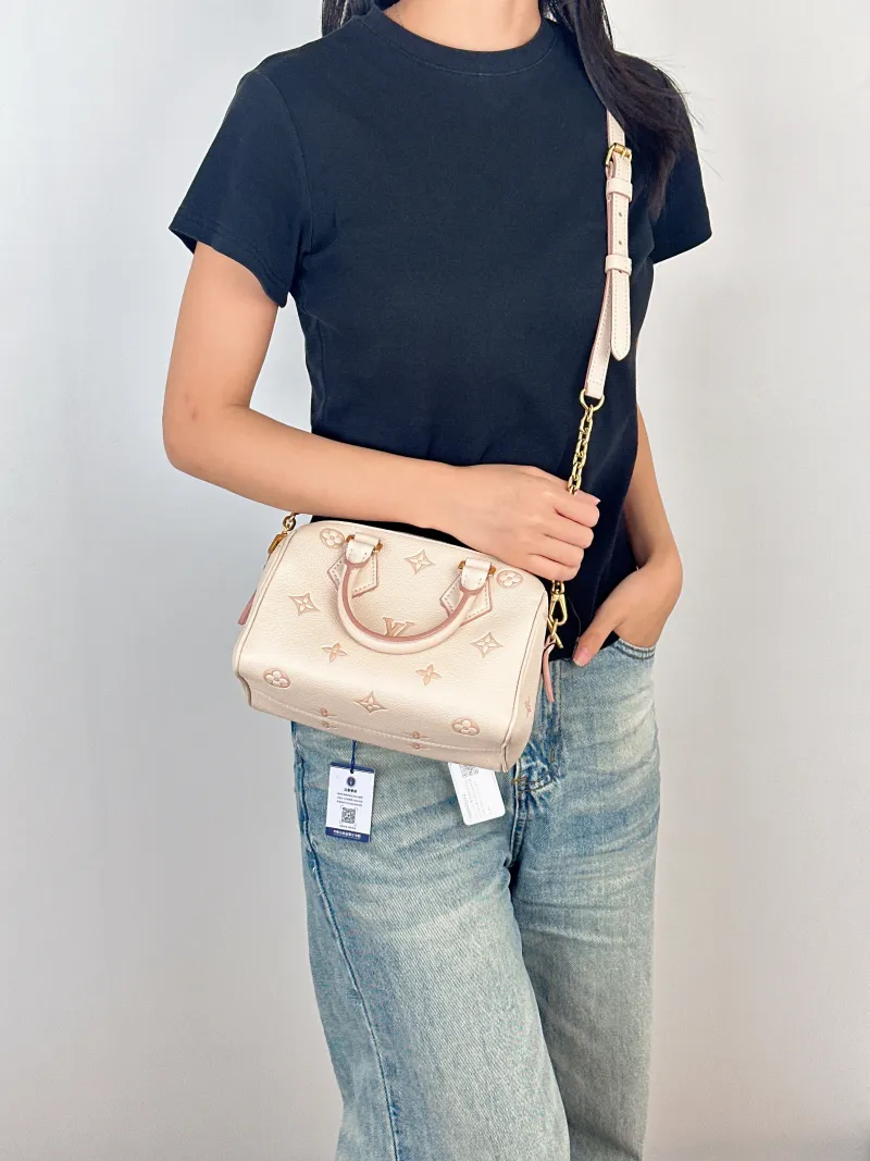 Louis Vuitton Crossbody Bag Speedy20Beige · Pink Empreinte Embossed Calfskin Small20.5 × 12 × 13.5 cm — on-model view 2 of 3