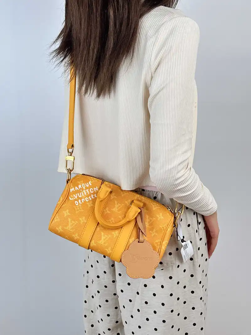 Louis Vuitton Crossbody Bag Keepall 25 Collection Yellow PVC Medium 25 × 11 × 15 cm — on-model view 2 of 3