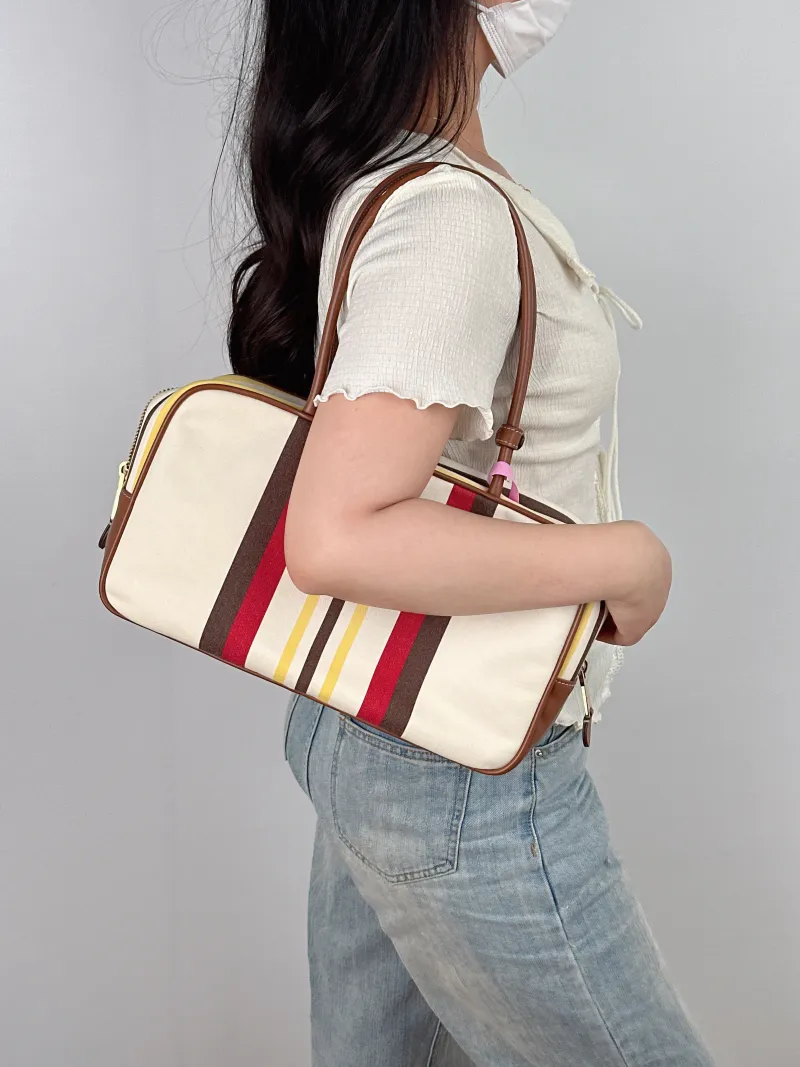 Miumiu Top Handle Bag Beau Colorblock Canvas · Calfskin Large 34 × 10 × 23 cm — on-model view 2 of 2