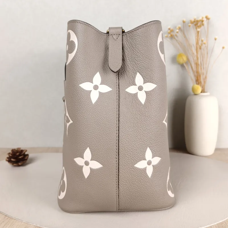 Louis Vuitton Shoulder Bag NÉONOÉ Bucket Bag · White Monogram Empreinte Embossed Calfskin Medium 26 × 17.5 × 26 cm — detail view 1 of 13