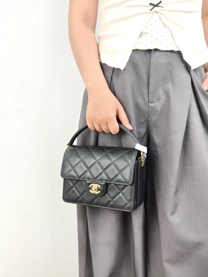 Chanel Crossbody Bag Black with Gold-Tone Hardware Grained Calfskin Small 19 × 6 × 15 cm — on-model view 3 of 3