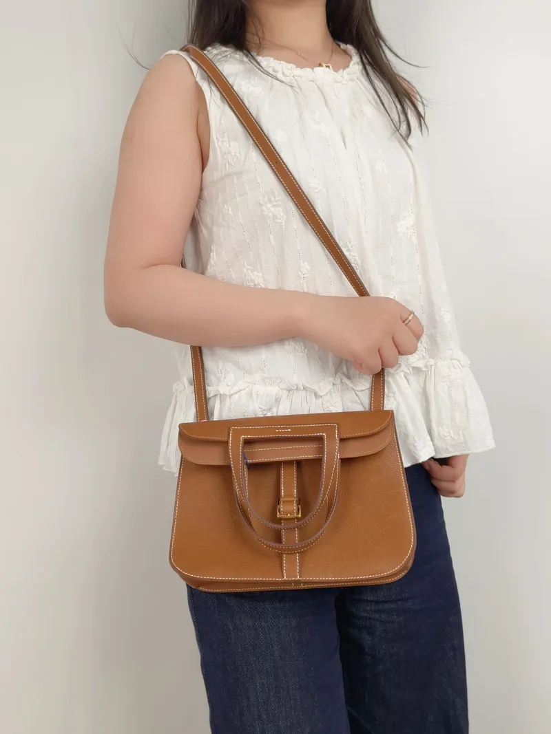 Hermès Shoulder Bag Halzan 25 Brown Saddle Leather Small25 × 8 × 17 cm — on-model view 1 of 3