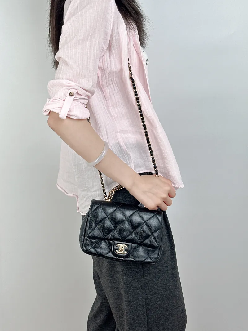 Chanel Crossbody Bag Black Lambskinmini19 × 8.5 × 14 cm — on-model view 2 of 3
