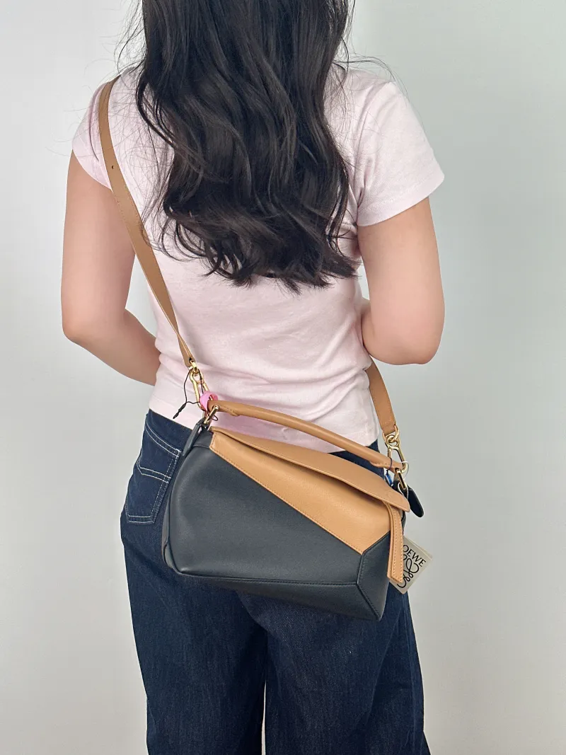LOEWE Crossbody Bag Puzzle Brown Black CC alfskin Small 24 × 10.5 × 16.5 cm — on-model view 1 of 2