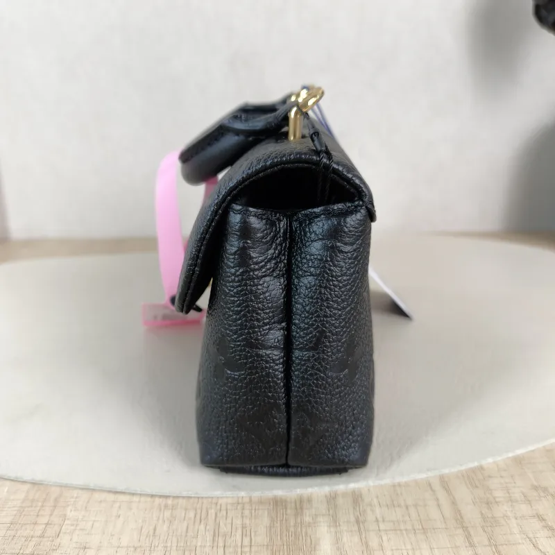 Louis Vuitton Crossbody Bag MADELEINE Black Monogram Empreinte Embossed Calfskin nano 21 × 6 × 12.5 cm — detail view 4 of 12