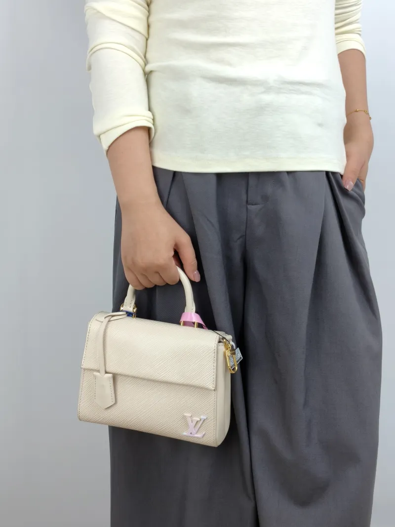 Louis Vuitton Crossbody Bag CLUNY White Epi Embossed Calfskin Mini 20 × 7.5 × 16 cm — on-model view 3 of 3