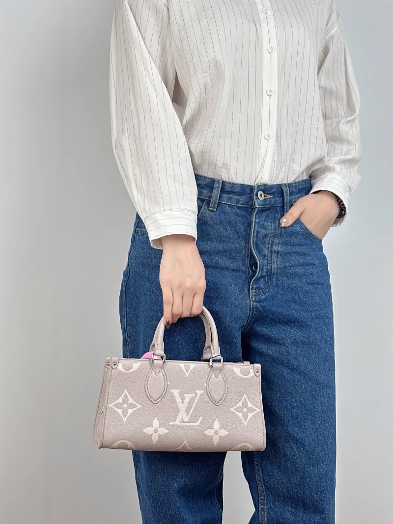 Louis Vuitton Crossbody Bag Onthego East West Two Straps Grey Monogram Empreinte Embossed Calfskin Small 25 × 10 × 13 cm — on-model view 2 of 3