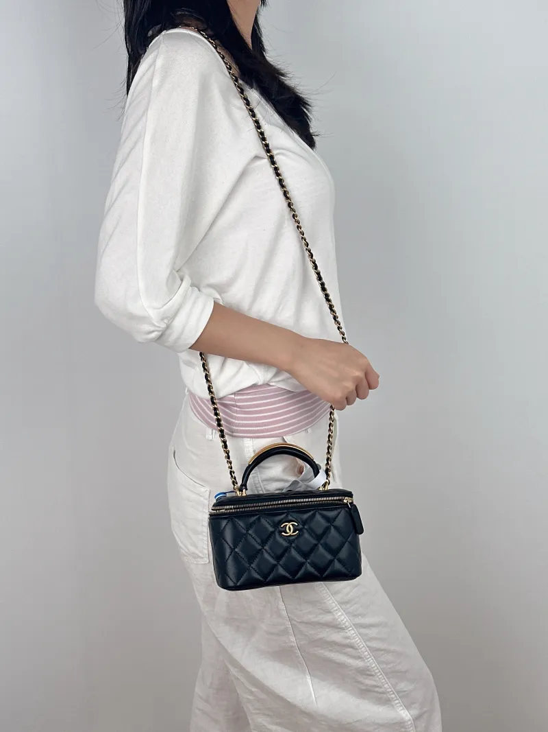 Chanel Crossbody Bag Edition Black with Gold-Tone Hardware Lambskin Mini 16 × 8 × 9.5 cm — on-model view 2 of 3