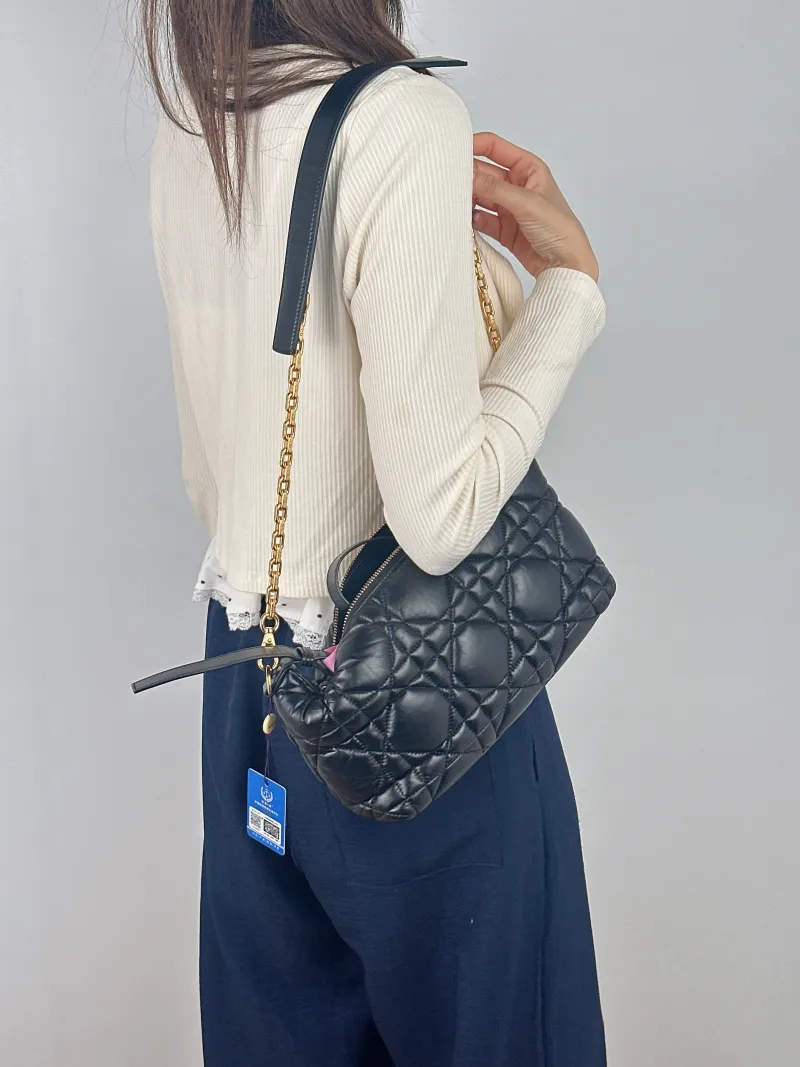 DIOR Crossbody Bag Sac Nomad Clutch Vanity Case Bag Black Calfskin Small 34 × 10 × 17 cm — on-model view 1 of 2