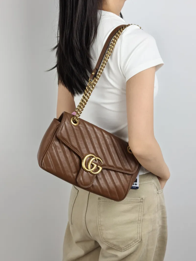 GUCCI Crossbody Bag GG Marmont Medium Marmont 26 Caramel Calfskin 26 × 7 × 15 cm — on-model view 1 of 2
