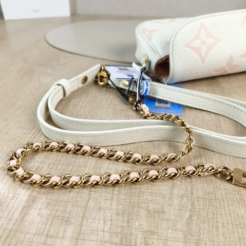 Louis Vuitton Crossbody Bag IVY White · Pink Empreinte Embossed Calfskin Small 23.5 × 4.3 × 12 cm — detail view 7 of 12