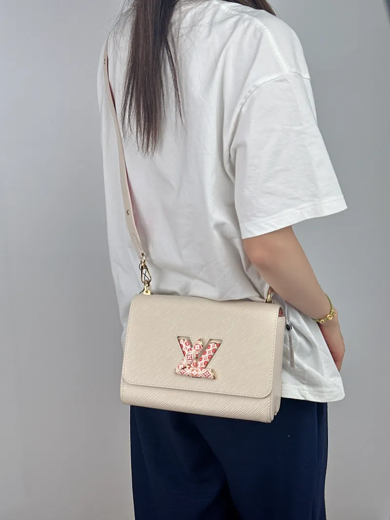 Louis Vuitton Crossbody Bag Twist White Epi Embossed Calfskin Pink 23 × 9.5 × 17 cm — on-model view 1 of 2