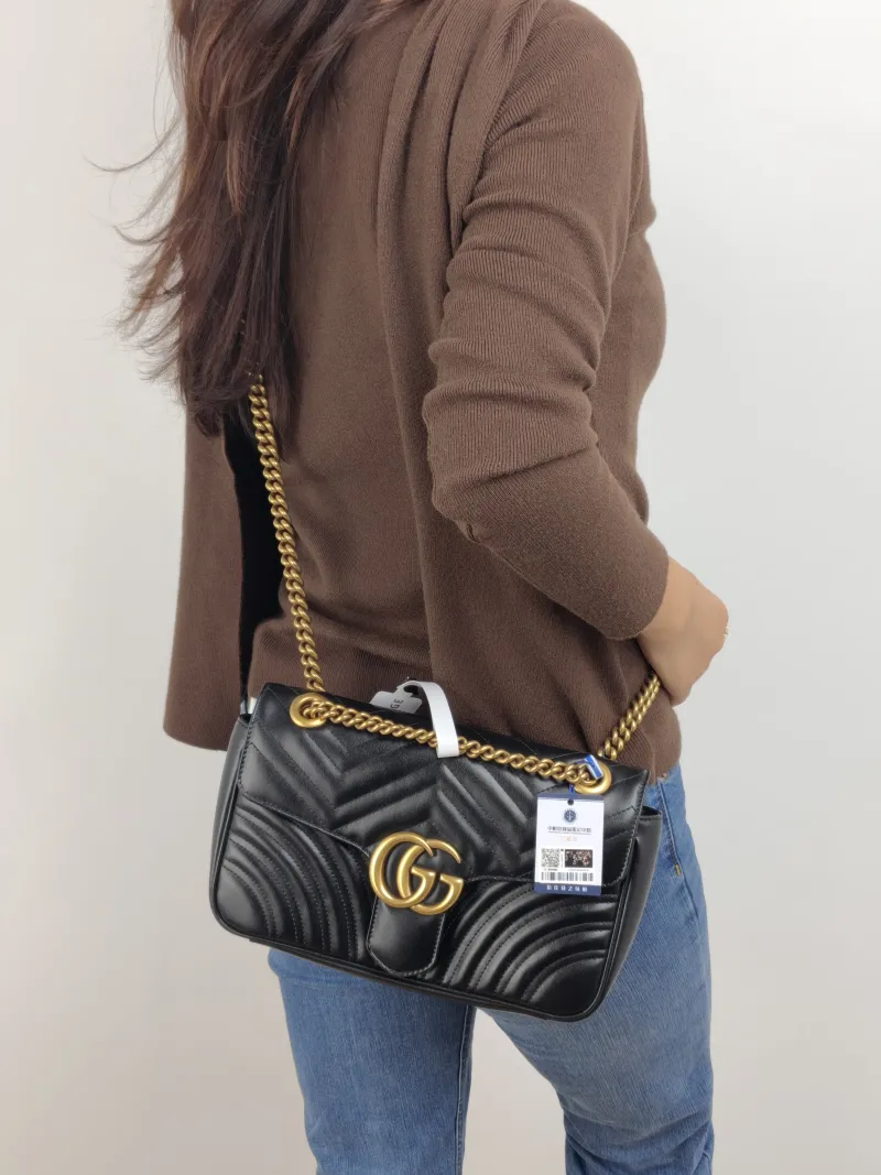 GUCCI Crossbody Bag GG Marmont Medium Marmont 26 Black CC alfskin Medium 26 × 7 × 15 cm — on-model view 1 of 2