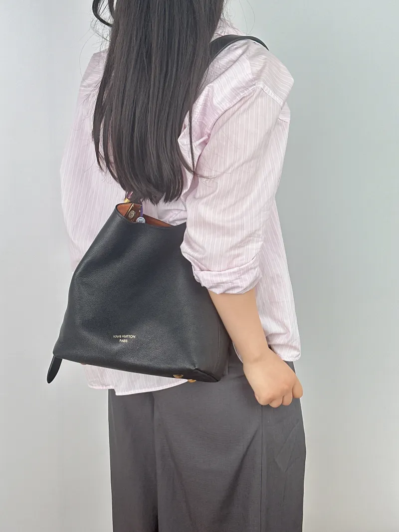 Louis Vuitton Shoulder Bag Low Key Hobo Shoulder Bag Black Calfskin Small 24 × 16 × 28 cm — on-model view 2 of 2