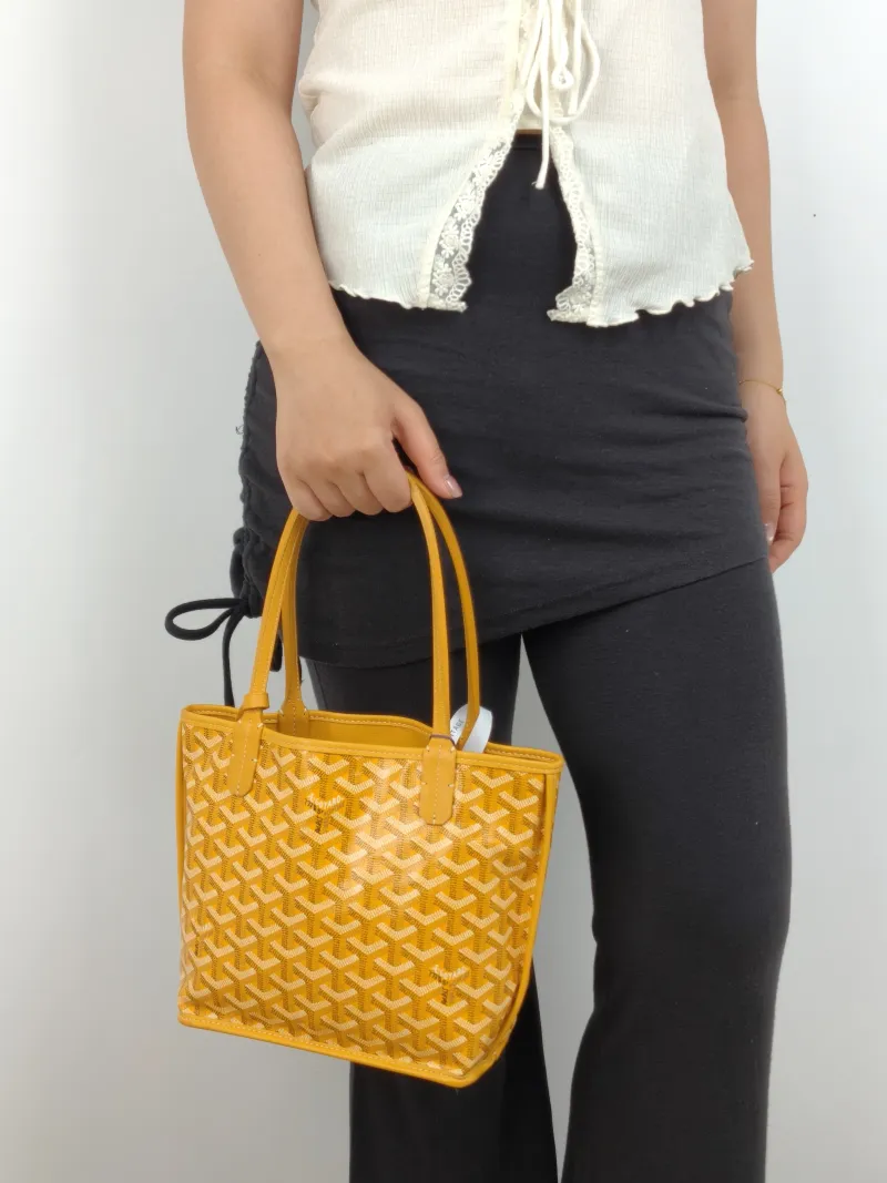 GOYARD Top Handle Bag ANJOU Shopping Tote Yellow PVC Mini 19.5 × 9 × 19.5 cm — on-model view 2 of 2