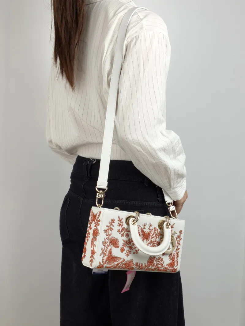 DIOR Shoulder Bag Lady D-Sire Red Embroidered White Red Calfskin Small 26 × 5 × 13 cm — on-model view 1 of 3