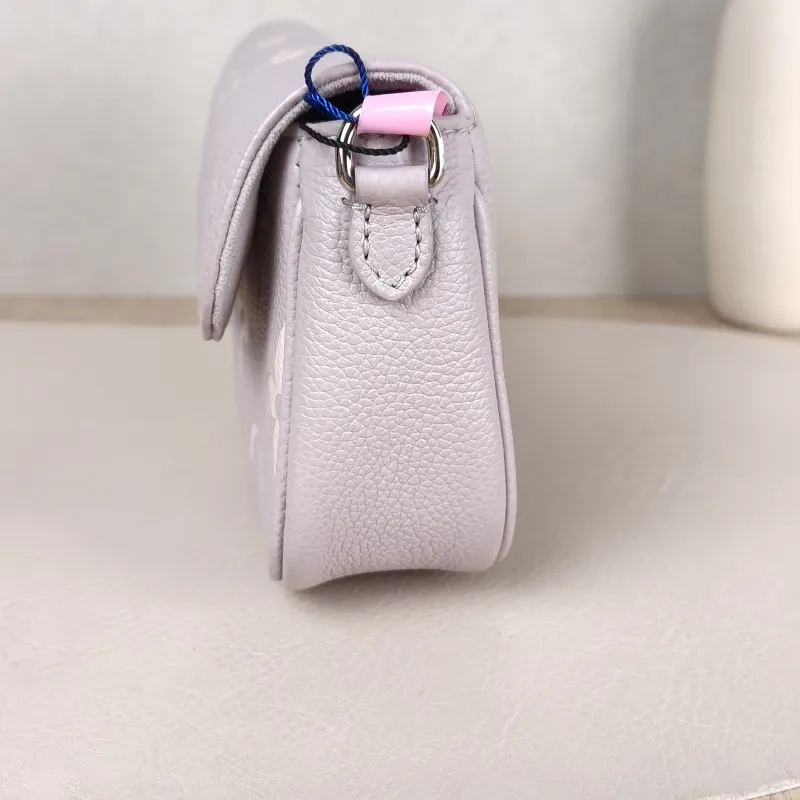 Louis Vuitton Crossbody Bag IVY Grey · White Monogram Empreinte Embossed Calfskin Small 23.5 × 4.3 × 12 cm — detail view 4 of 11