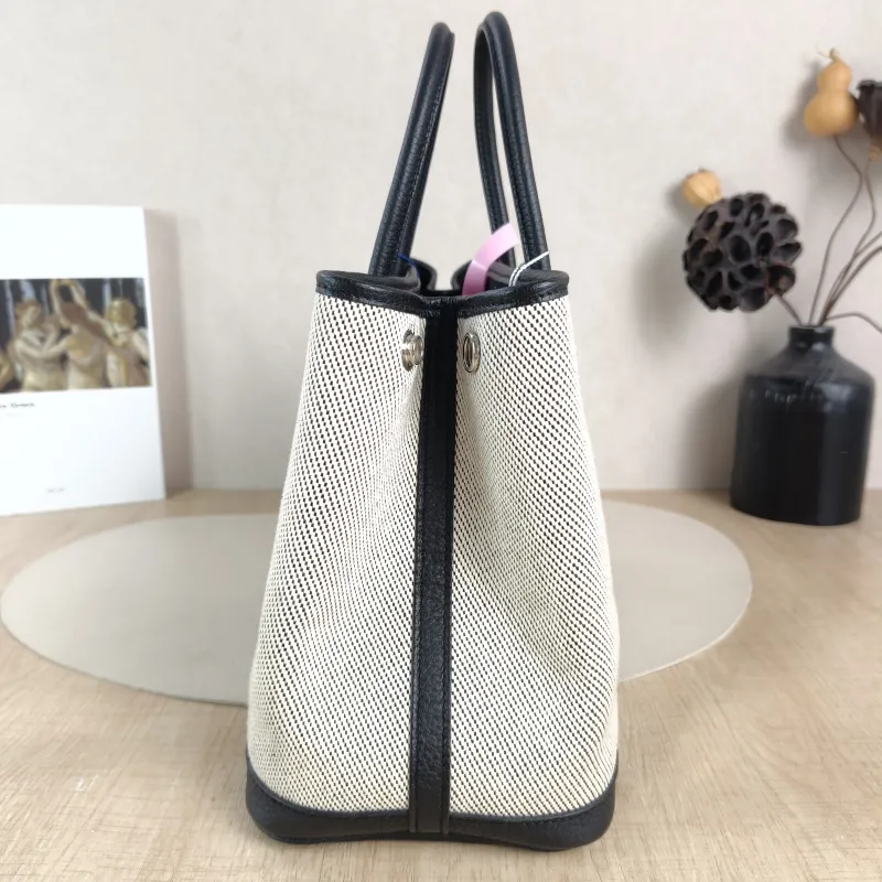 Hermès Top Handle Bag Garden Party 30 30 Beige · Black Canvas · Negonda Calfskin Medium 30 × 13 × 21 cm B — detail view 1 of 10