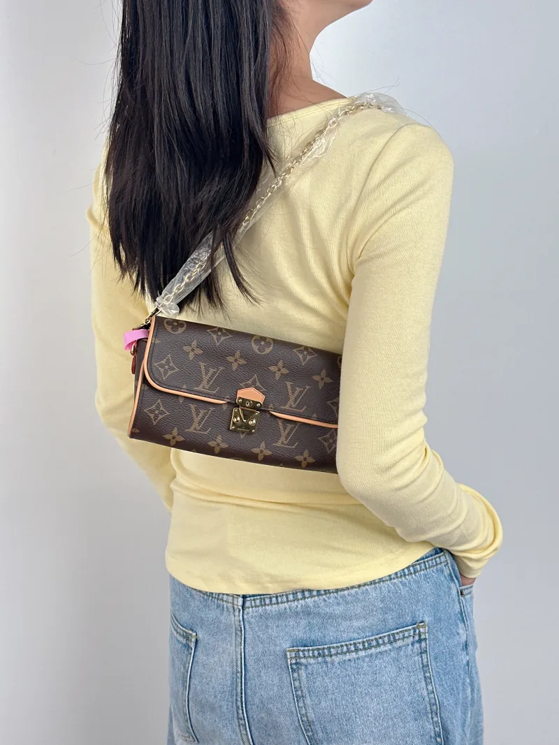 Louis Vuitton Crossbody Bag POCHETTE CAMILLE Monogram PVC One Size 20.5 × 6 × 11 cm — on-model view 1 of 2