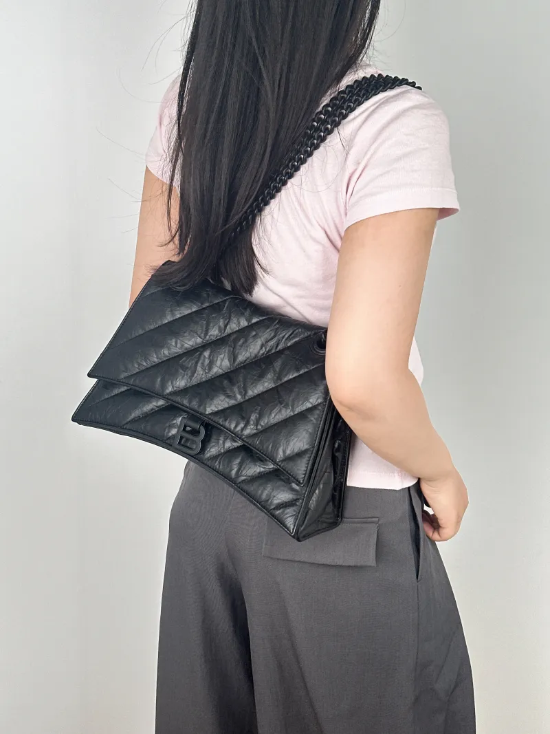 BALENCIAGA Shoulder Bag CRUSH Chain Bag Black Calfskin Medium30 × 13 × 20 cm — on-model view 1 of 2