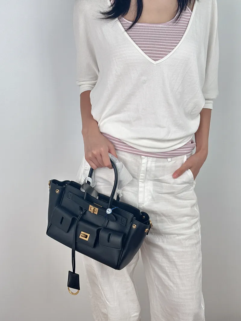 BALENCIAGA Crossbody Bag Bel air Black with Gold-Tone Hardware Calfskin Mini 23.5 × 8 × 17 cm — on-model view 1 of 3