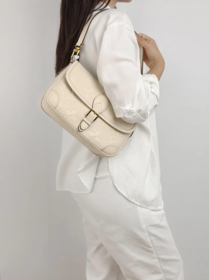 Louis Vuitton Crossbody Bag Diane Baguette Bag White Empreinte Embossed Calfskin Small 24 × 9 × 15 cm — on-model view 1 of 2