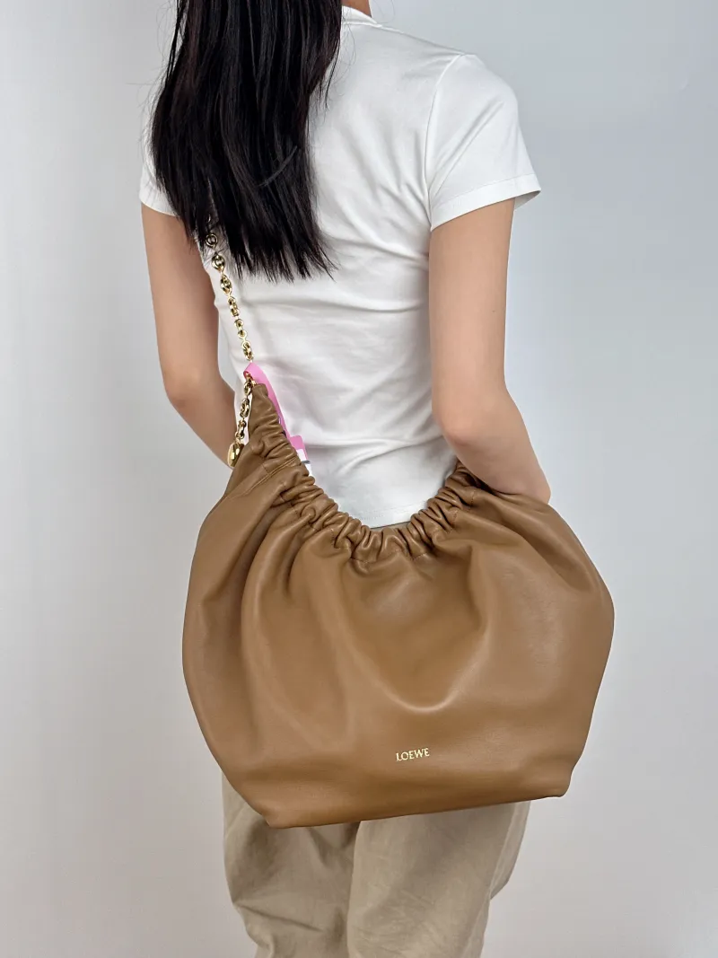LOEWE Crossbody Bag Squeeze Lambskin Medium 34 × 13.5 × 33 cm — on-model view 1 of 2