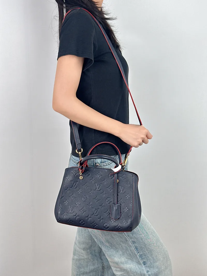 Louis Vuitton Top Handle Bag Montaigne Blue Calfskin 25 × 10 × 20 cm — on-model view 3 of 3