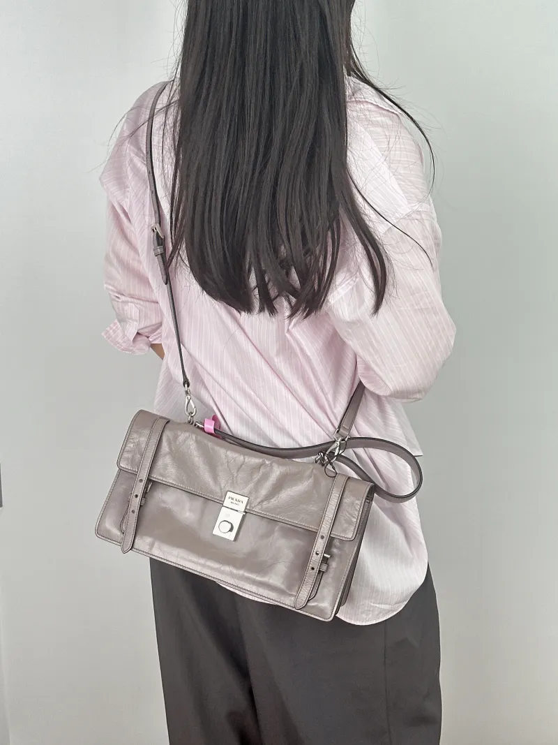 PRADA Shoulder Bag Shoulder Bag Grey Waxed Leather Calfskin One Size 32 × 10 × 17 cm — on-model view 1 of 2