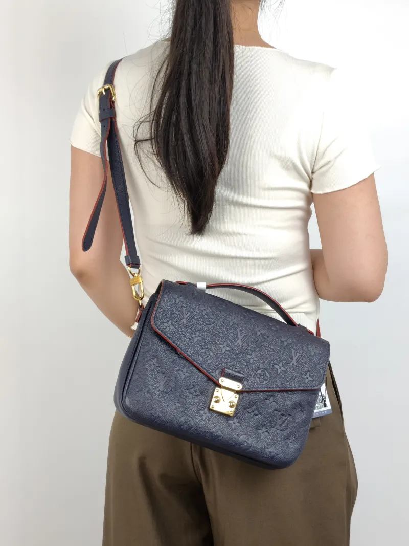 Louis Vuitton Crossbody Bag Pochette Métis · Monogram Empreinte Embossed Calfskin Medium 25 × 7 × 19 cm — on-model view 3 of 3