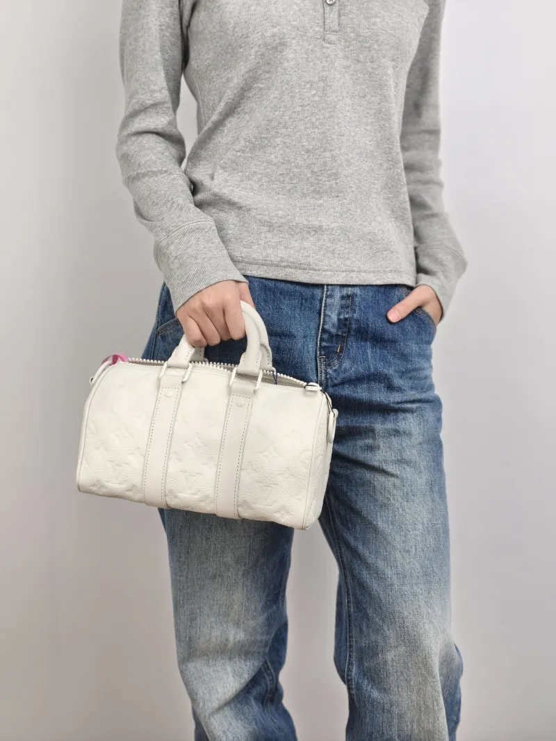 Louis Vuitton Crossbody Bag Keepall 25 White Calfskin Medium 25 × 11 × 15 cm — on-model view 3 of 3