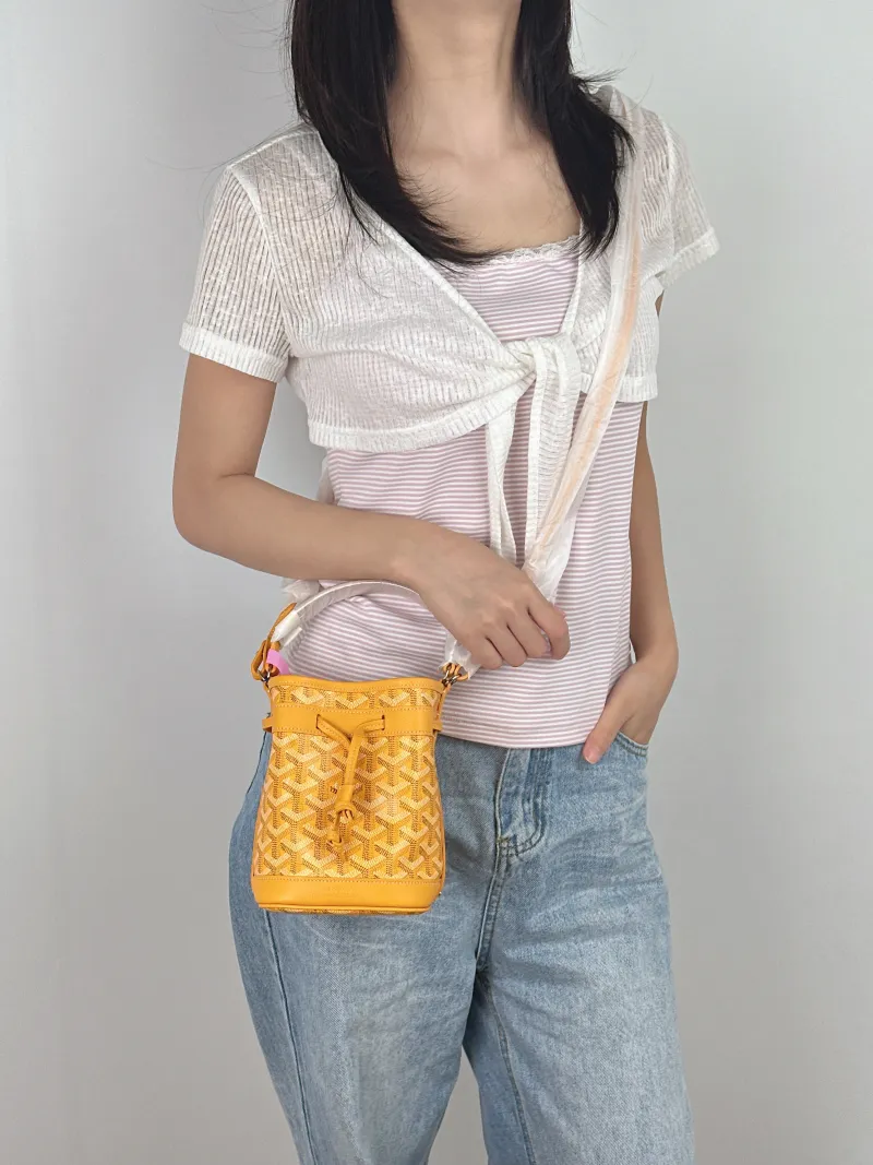 GOYARD Crossbody Bag Petit Flot Yellow ine Canvas Mini 12 × 10 × 17.5 cm — on-model view 3 of 3