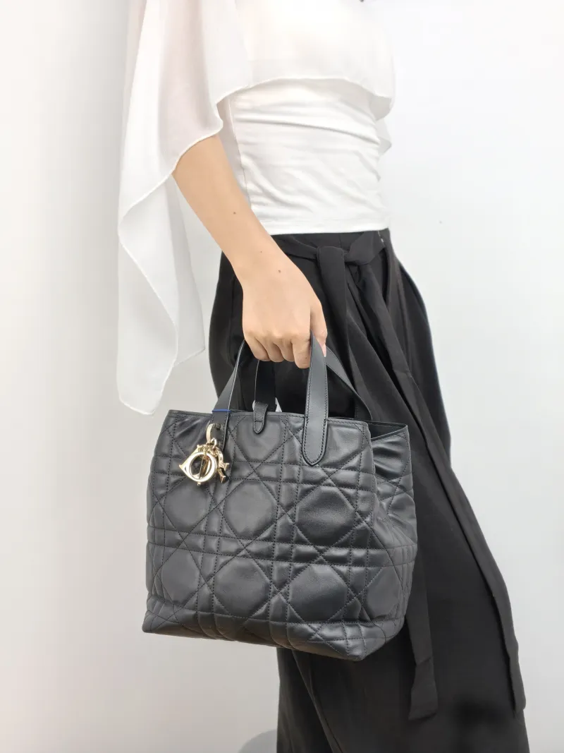 DIOR Top Handle Bag TOUJOURS Edition Black Calfskin Medium 23 × 16 × 24 cm — on-model view 1 of 2