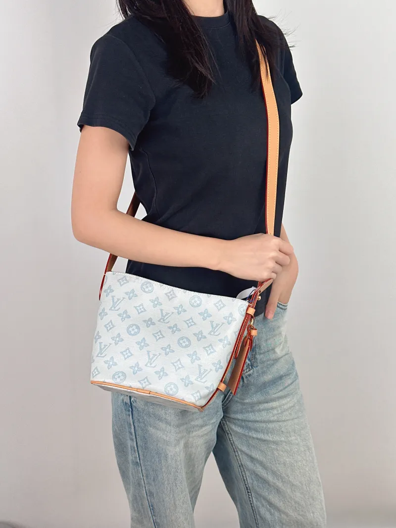 Louis Vuitton Top Handle Bag ALL IN BB Blue PVC BB 16 × 12 × 18 cm — on-model view 1 of 3