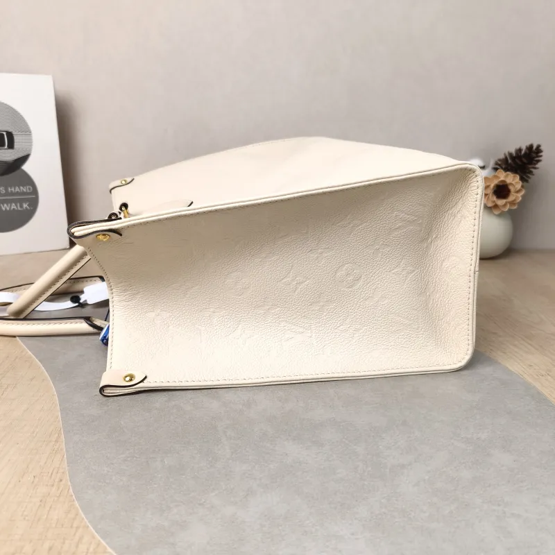Louis Vuitton Shoulder Bag Onthego Medium White Monogram Empreinte Embossed Calfskin Medium 35 × 14 × 27 cm — detail view 1 of 12