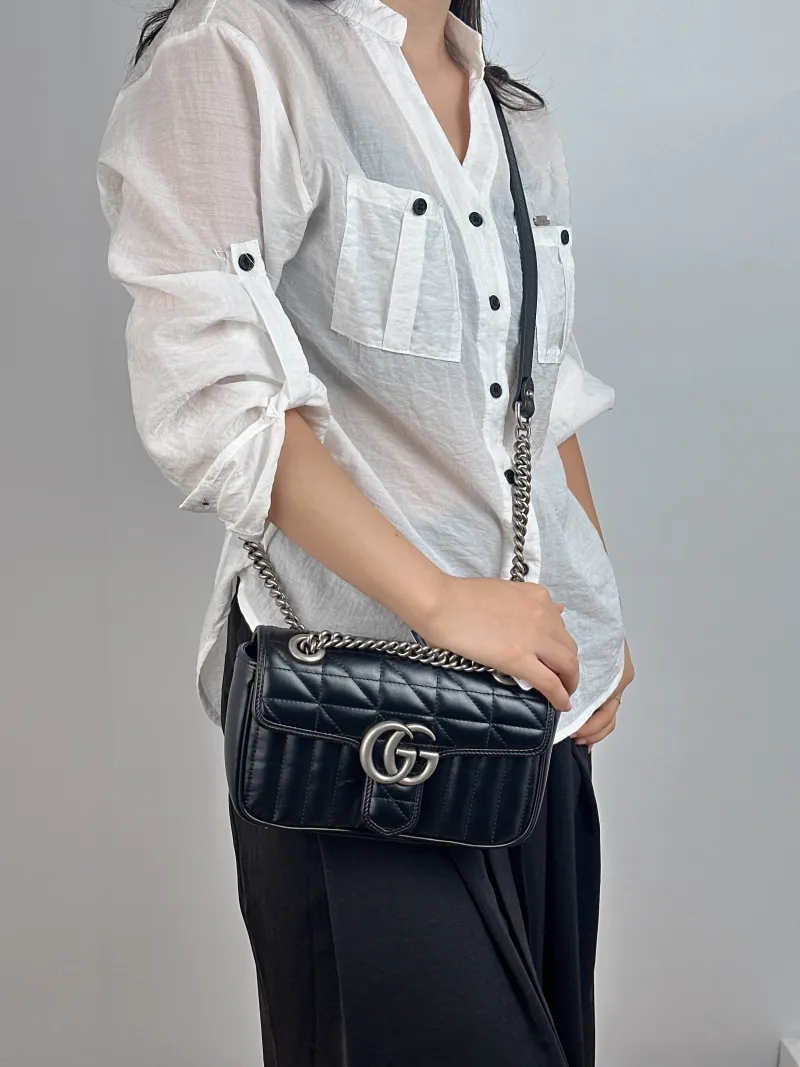 GUCCI Crossbody Bag GG Marmont Small Marmont 22 Black Calfskin Small 22 × 6 × 13 cm — on-model view 2 of 2