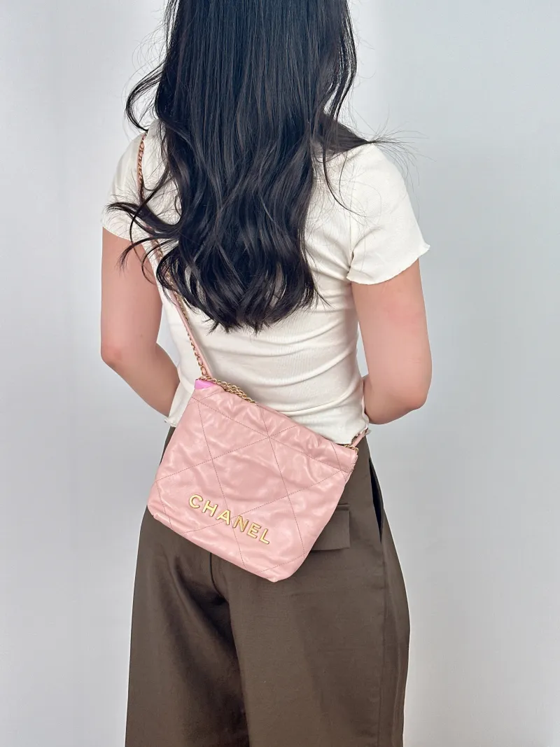 Chanel Crossbody Bag22Bag Pink Calfskinmini20 × 6 × 19 cm — on-model view 1 of 2
