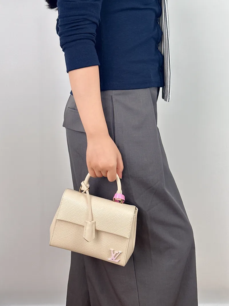 Louis Vuitton Crossbody Bag CLUNY White Epi Embossed Calfskin Mini 20 × 7.5 × 16 cm — on-model view 1 of 2