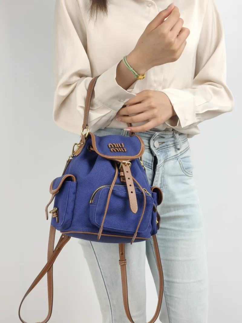 Miumiu Backpack Backpack Blue Brown Canvas Medium 18 × 11.5 × 22 cm — on-model view 2 of 3