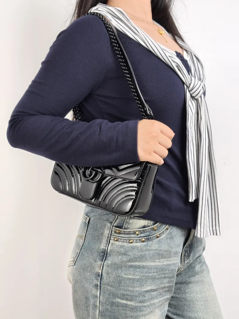 GUCCI Crossbody Bag GG Marmont Small Marmont So Black 22 Black Patent Leather Small 22 × 6 × 13 cm — on-model view 2 of 2